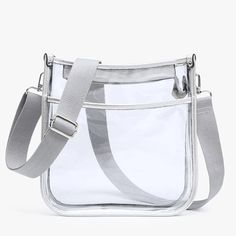 Posie Clear Crossbody With Vegan Leather Trim Silver * Clear Crossbody, Perfect For Game Days * Top Zipper Closure * Front Open Pocket * Adjustable Guitar Strap * Vegan Leather Trim * Dimensions: 10"L X 10"’H X 2.5"D Last 2 Pictures Show Other Features In Other Colors Casual Clear Crossbody Shoulder Bag, Casual Clear Shoulder Bag, Guitar Strap, Leather Trim, Front Open, Leather Trims, Silver Color, Vegan Leather, Guitar