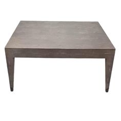 a square concrete coffee table with metal legs and a rectangular top, viewed from the front