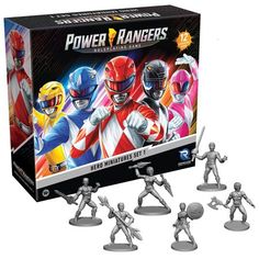 the power rangers action figures are shown in front of a box with four figurines