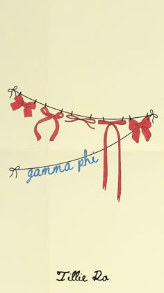 a red ribbon hanging from a clothes line with the words gama phi on it