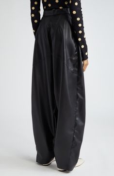 Angled oversized pockets complement the voluminous silhouette of these faux-leather balloon-leg pants featured in the designer's spring '24 runway show. 32" inseam; 19" leg opening; 15 1/2" front rise; 15 1/2" back rise (size 44 IT) Front snap closure Front patch pockets 100% polyester Dry clean Made in Italy Designer Clothing High-waisted Leather Pants For Evening, Wide Leg Leather Pants With Pockets For Party, Evening Wide Leg Leather Pants, Fall Evening Wide Leg Pants With Pockets, Oversized Pockets, Balloon Pants, Summer 24, Runway Show, Leather Fashion