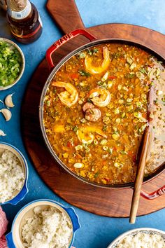 a large pan filled with seafood and rice