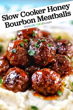 slow cooker honey bourbon meatballs on top of mashed potatoes with garnish