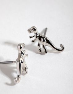 Description
You'll look T-errific in these! Get your dino-mite look started with these adorable t-rex studs. They'll make your heart saur.

Size: 1.3cm (L) x 6mm (W) 
Weight: 1g (one earring) Nose Piercings, Fashion Jewellery Online, One Earring, Bold Earrings, Nose Piercing, Favorite Rings, Everyday Jewelry, T Rex, Ring Necklace