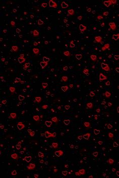 red hearts on a black background