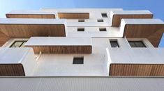 the facade of an apartment building with many balconies