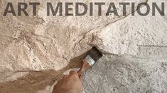 a man is painting the side of a wall with words that read art meditation on it