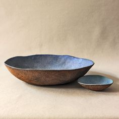 two bowls sitting next to each other on a table