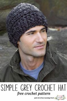 a man wearing a black knitted beanie looks off to the side in front of some rocks