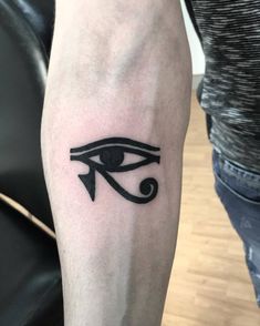 an egyptian eye tattoo on the arm