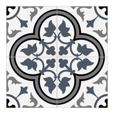 a black and white tile with an ornate design in the center, on a white background