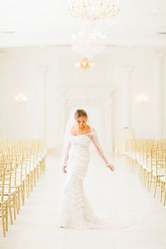 the bride is walking down the aisle in her wedding dress