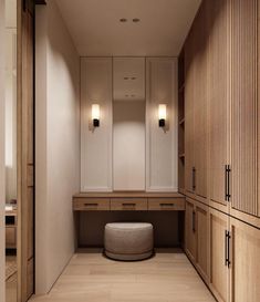 an empty dressing room with wooden cabinets and stools on the floor in front of it