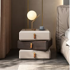 three suitcases stacked on top of each other in front of a bed with pillows