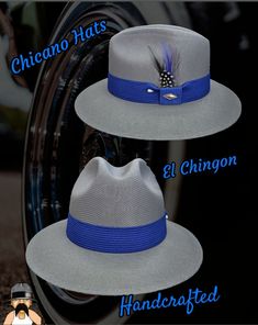 "Exclusive handcrafted Goldline fine finish Oxford Chingon made with the 100% finest cotton string material available, comfy elastic inner band, royal blue band, real rooster feather, pearl pin, 3\" brim." Handmade Blue Hat Bands For Summer, Handmade Blue Hat Band For Summer, Blue Adjustable Custom Hat Bands, Traditional Fitted Blue Hat, Elegant Adjustable Blue Hat Band, Blue Curved Brim Hip Hop Hat, Blue Brimmed Fedora For Western-themed Events, Adjustable Blue Fedora For Western-themed Events, Vintage Blue Snapback Hat For Streetwear