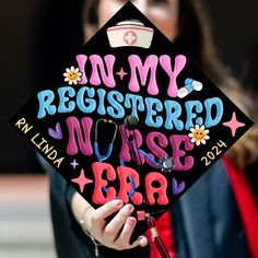 a woman wearing a graduation cap with the words in my register nurse written on it