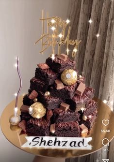 there is a cake that has been decorated with chocolates and candies on it