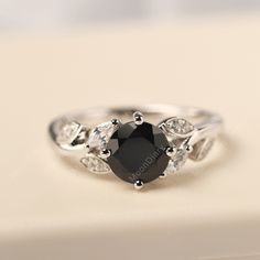 Anniversary Black Sapphire Ring, Black Sapphire Ring With Prong Setting For Promise, Elegant Black Spinel Sapphire Ring For Anniversary, Black Sapphire Ring In Sterling Silver, Square Cut Engagement Rings, Emerald Cut Sapphire Ring, Moonstone Engagement Ring Rose Gold, Twig Engagement Ring, Black Engagement Ring