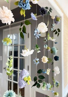 some paper flowers are hanging from the ceiling