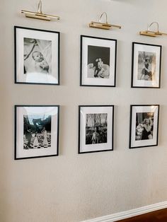 black and white photographs hanging on the wall