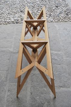 a wooden table sitting on top of a stone floor