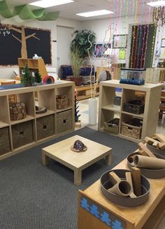 a room filled with lots of different types of toys and furniture in baskets on the floor