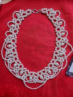 This listing is for a lovely vintage style one-strand festoon glass pearl necklace.  It measures 16 inches long.  I can add a chain to it that will allow you to extend it longer to make it more adjustable.  Just mention that at checkout. Perfect for your everyday or historical/costuming needs.  This necklace spans the test of time, and can be worn for multiple centuries as well as today.  These are hard to find.  I changed the clasp to a silver hook and ring to make it more period appropriate. Y Marie Antoinette Necklace, Vintage Pearl Necklace As Gift, Vintage Pearl Embellished Necklace As Gift, Vintage Pearl Embellished Necklace For Gift, White Victorian Pearl Necklace, Vintage Pearl Chain Beaded Necklace Gift, Vintage Handmade Pearl Necklace For Formal Occasions, Handmade Vintage Pearl Necklace For Formal Occasions, Vintage White Pearl Necklace For Jewelry Making