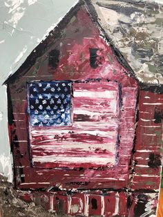 a painting of an american flag on the side of a red barn