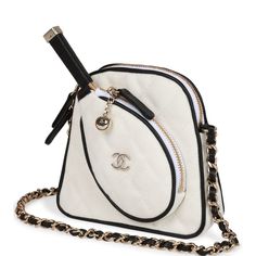 This Limited Edition Runway Tennis mini crossbody bag is in white canvas with light gold tone hardware and has a pocket for tennis racquet mirror, half moon back pocket and an interwoven light gold tone metal chain link and black leather cross body strap. The interior is lined in white canvas and features a half moon back pocket. Collection: 23C Origin: France Condition: Pristine; new or never Accompanied by: Chanel box, Chanel dustbag, carebook, ribbon, and retail UPC Measurements: 5" width x 3.5" height x 2" depth; 23" strap drop Crossbody Bag Chanel, Chanel Tennis Bag, Tennis Essentials, Chanel Tennis, Monaco Style, Chanel Mini Rectangular, Badminton Bag, Tennis Bags, Tennis Bag