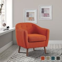 an orange chair sitting on top of a rug in front of a white window sill