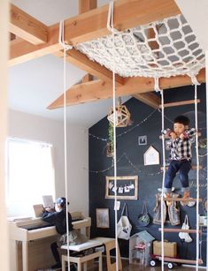 a child is climbing on a ladder in the room