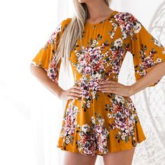 This lovely floral romper is the perfect combination of sassy but sweet. Featuring flare sleeves, an open back with a cinched waist and a loose fit legs; this romper pairs perfectly with wedges, sandals or open toe booties. Made with a cotton and polyester blend this romper is comfy and cute. Comes in two fabulous floral color patterns. Cherry Print Dress, Short Beach Dresses, Half Sleeve Jumpsuit, Short Dress White, Boho Dresses Long, Floral Print Jumpsuit, Floral Print Rompers, Floral Dresses Long, Womens Playsuits