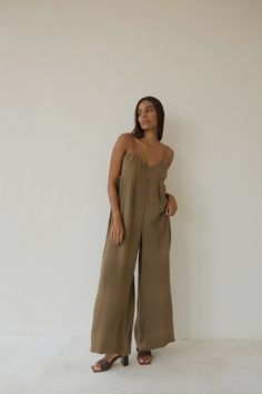 BAHHGOOSE SIGNATURE RIO JUMPSUIT Maxi Length Jumpsuit, features adjustable straps, elegant open back. Wide legged oversized fit. Carol wear XS/S 30% cotton 70% linen Overall Jumpsuits And Rompers With Adjustable Straps For Loungewear, Adjustable Straps Jumpsuit Overalls For Loungewear, Summer Workwear Jumpsuits And Rompers With Adjustable Straps, Summer Workwear Full-length Jumpsuits And Rompers, Full Length Summer Jumpsuits And Rompers For Work, Full-length Summer Jumpsuits For Work, Elegant Spring Jumpsuits And Rompers With Adjustable Straps, Elegant Relaxed Fit Jumpsuit In Solid Color, Chic Full Length Jumpsuits And Rompers For Loungewear