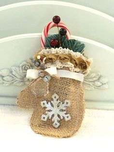 a burlap bag with a snowflake and candy canes on it