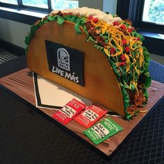 a taco cake that has been made to look like it is being served at a restaurant