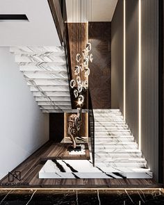 an elegant staircase with marble steps leading up to the second floor and chandelier