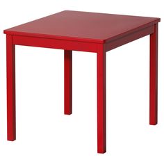 a red table sitting on top of a white floor