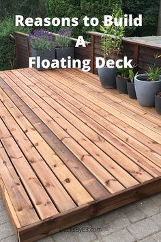 a wooden deck with potted plants on it and the words 5 reasons to build a floating deck