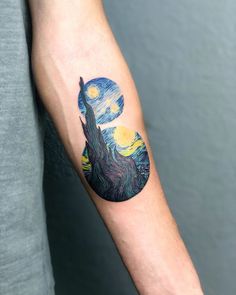 a person with a tattoo on their arm has a starry night sky behind the tree