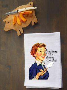 a tea towel with an image of a woman holding a knife on top of it