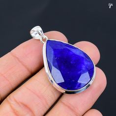 Welcome to StunningJewelryArts Blue Sapphire Gemstone Handmade 925 Sterling Silver Pendent  925 Stamped Gemstone Blue Sapphire gemstone Pendent For Gift *The most unique jewelry you can find, a perfect gift for you and your loved one PRODUCT INFORMATION * Gemstone : blue sapphire * Stone Shape : Same As Picture * Stone Category : Cabochon * Stone Polish : High * Metal : 925 Sterling Silver * Purity : 925 Parts Per 1000 * Silver Polish : High * Benefits Of Wearing Silver As a metal, silver has si Tanzanite Gemstone Round Pendant, Tanzanite Gemstone Round Pendant Jewelry, Faceted Tanzanite Jewelry Gift, Faceted Tanzanite Jewelry For Gifts, Silver Tanzanite Pendant Jewelry, Sapphire Drop Gemstone Jewelry, Silver Faceted Tanzanite Jewelry, Sapphire Drop Beads For Jewelry Making, Blue Teardrop Pendant Jewelry With Large Stone