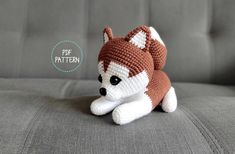 a crocheted stuffed animal sitting on top of a couch