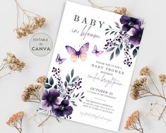 a baby shower with purple flowers and butterflies