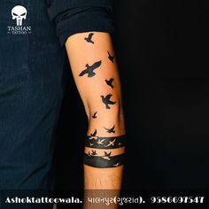 a man's arm with birds on it