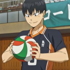 an anime character holding a ball in his hand