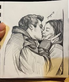 a drawing of a man and woman kissing in front of each other with the caption's name written on it