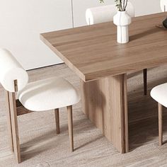 a wooden table with white chairs and vases on it in a dining room setting