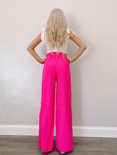 Meet the Paradise Pink Pants from Sassy Shortcake. These bright, neon pink pants are sure to stand out! They feature a hidden back zipper and a flowy fit. Lined true to size, model wearing a size small content: 100% polyester care: hand wash cold Chic Pink Pants With Elastic Waistband, Neon Bottoms For Summer Party, Pink High-waisted Bottoms For A Day Out, Pink High-waisted Pants For Day Out, Stretch Pink Bottoms For Day Out, Chic Pink Stretch Wide Leg Pants, Chic Stretch Wide Leg Pants In Pink, Chic Stretch Pink Wide Leg Pants, Trendy Pink Wide Leg Pants With Elastic Waistband