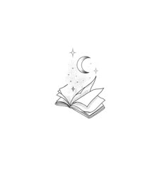 an open book sitting on top of a table next to a star and crescent moon