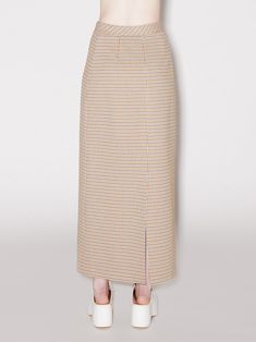 A new silhouette for the Prefall season, this maxi skirt is crafted in the seasonal Houndstooth Plaid Interlock Jacquard. This favorite fabric is ideal for this style, allowing for ease of wear while still looking streamlined and flattering the silhouette. An exclusive fabrication for the season, the Houndstooth Plaid Interlock Jacquard is similar to our Interlock Jersey with a slightly slick hand and added elastic to contour the body. It’s produced by an Italian mill certified for its sustainab Dogstooth Skirt, Rosetta Getty, Platform Clogs, Denim T Shirt, Pre Fall, Sweater Skirt, Summer Sale, T Shirt Top, Denim Dress